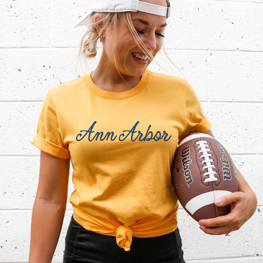 Maize t-shirt that says "Ann Arbor" in script font