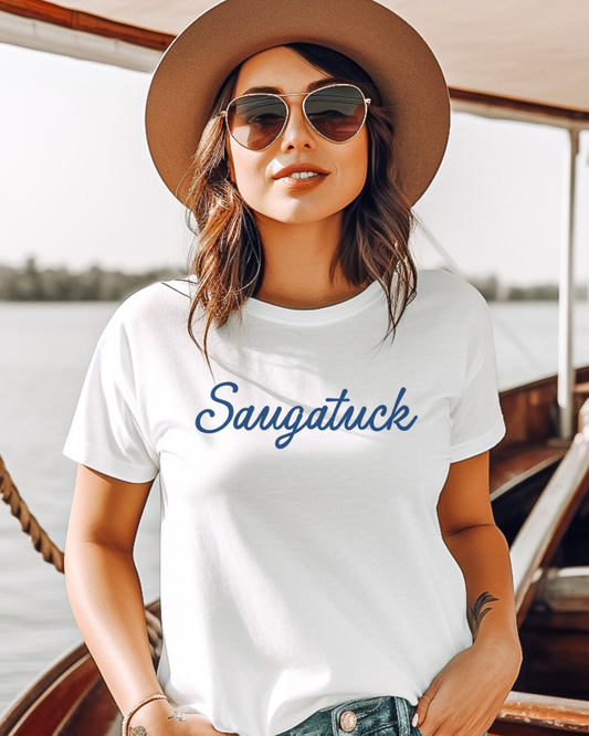 Woman wearing a white t-shirt with 'Saugatuck' text on a boat.