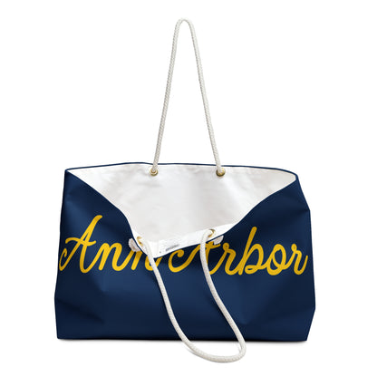 Navy tote bag with 'Ann Arbor' in yellow on a white background